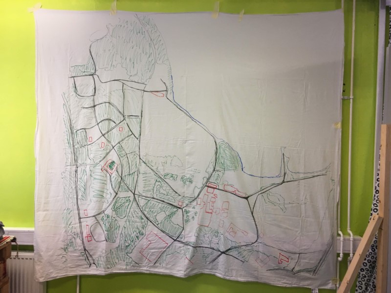 A bedsheet taped to the wall with a map of Hiedanranta.